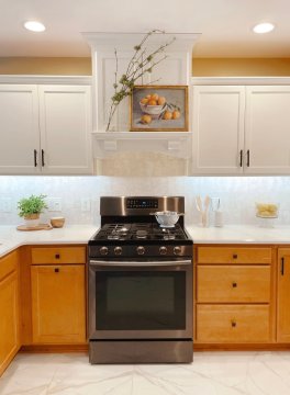 1. The kitchen features a modern stainless steel gas stove, ...
