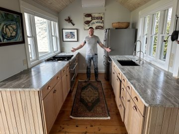 \"The sleek, marbled countertops exude a sense of modern ele...