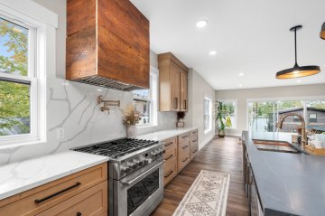 \"Rich wooden cabinets exude warmth and charm, perfectly com...