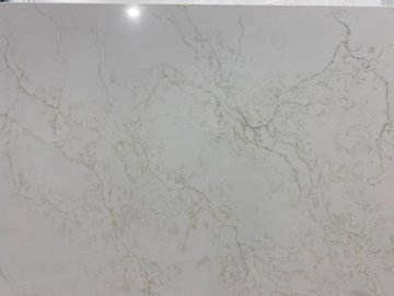 "These stunning quartzite countertops showcase a delicate in...