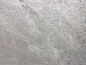 "These stunning quartzite countertops showcase a delicate in...