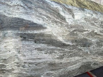 "These stunning quartzite countertops showcase a mesmerizing...