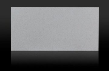 "A sleek, light gray quartz countertop exudes modern eleganc...