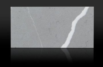 "A sleek gray quartz countertop showcases a sophisticated bl...