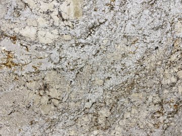 "The stunning granite countertops showcase a mesmerizing ble...