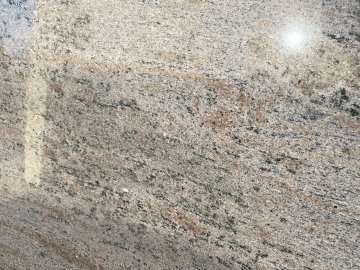 "The stunning granite countertops showcase a beautiful blend...