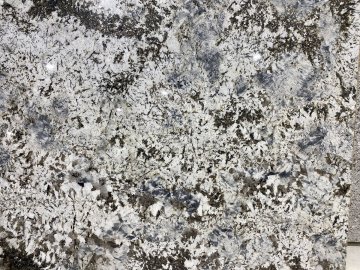 "The stunning granite countertops showcase a mesmerizing ble...