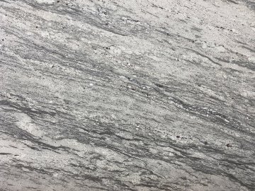 "The stunning granite countertops showcase a mesmerizing ble...