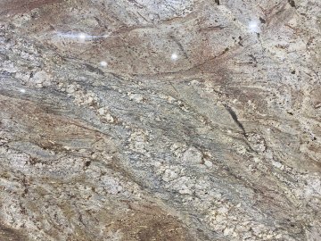 "Rich swirls of earthy tones dance across the granite surfac...