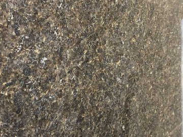 "The rich, earthy tones of the granite countertops create a ...