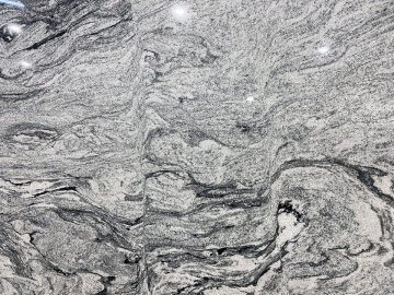 "The stunning granite countertops showcase a mesmerizing swi...